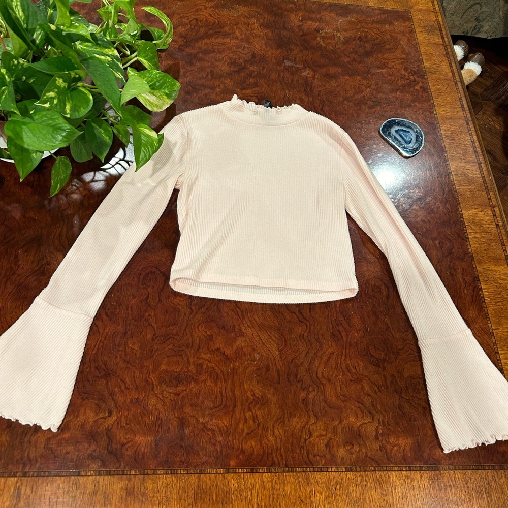Peachy pink bell-sleeved top